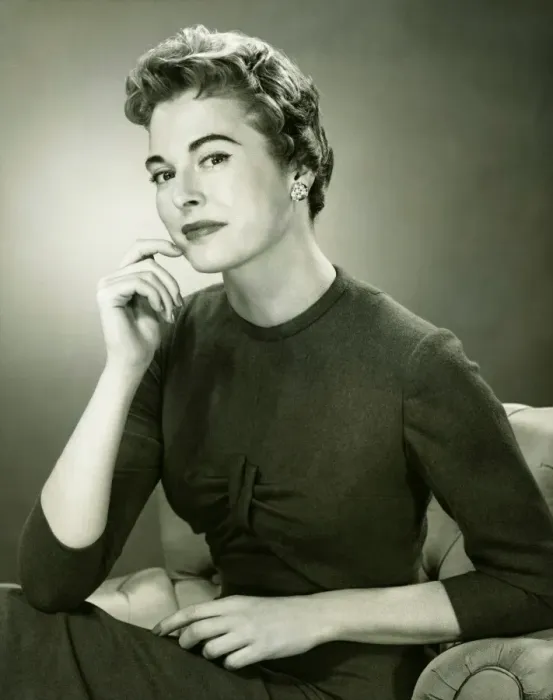 Framed Print : Smiling woman sitting in armchair in studio, (B&W), portrait Framed Print : Smiling woman sitting in armchair in studio, (B&W), portrait