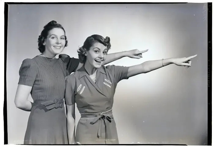 Framed Print : Two Smiling Women Pointing Framed Print : Two Smiling Women Pointing