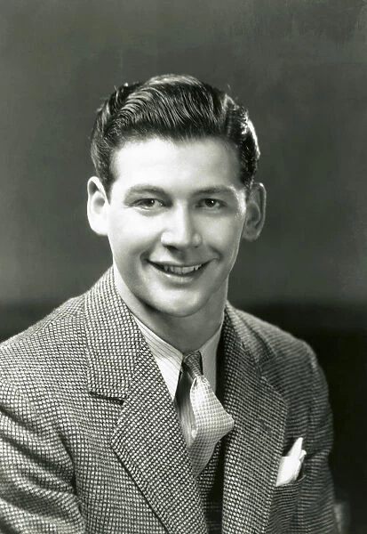 Smiling young man in business suit