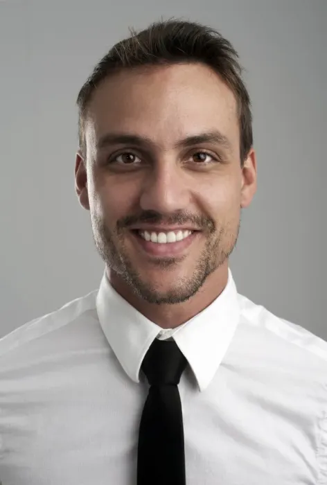Framed Print : Smiling young man wearing a shirt and a tie, portrait Framed Print : Smiling young man wearing a shirt and a tie, portrait