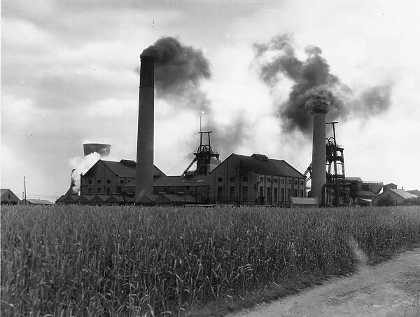 Smoke rising from the chimneys of the main colliery at Askern, Yorkshire