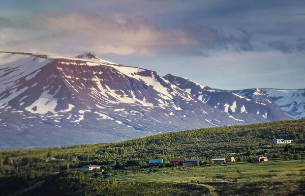 Snow-Capped Mountains and Green Hillside Outside Akureyri, Iceland