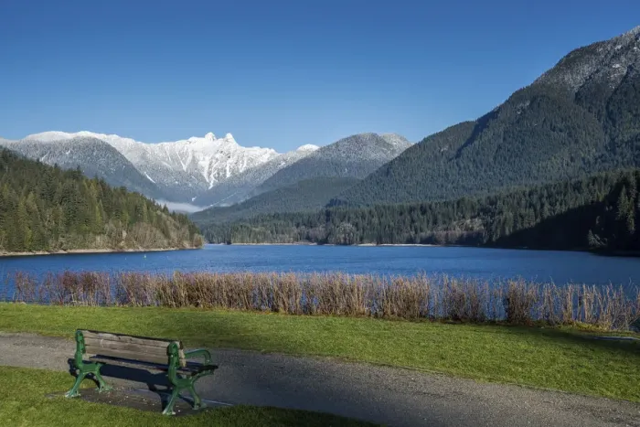 Framed Print : Snow-capped mountains above lake and meadow with bench, British Columbia, Canada Framed Print : Snow-capped mountains above lake and meadow with bench, British Columbia, Canada