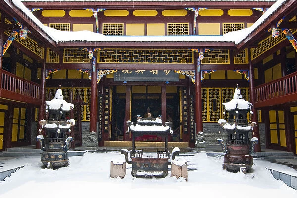 Snow on courtyard in Dragon King rear temple of Huanglong Temple buildings, Huanglong National Park, Sichuan Province, China