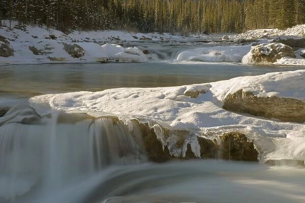 Snow Over The Elbow Falls And The Elbow River In Winter