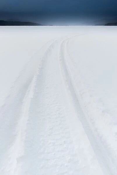 Snow mobile path on frozen Akan lake