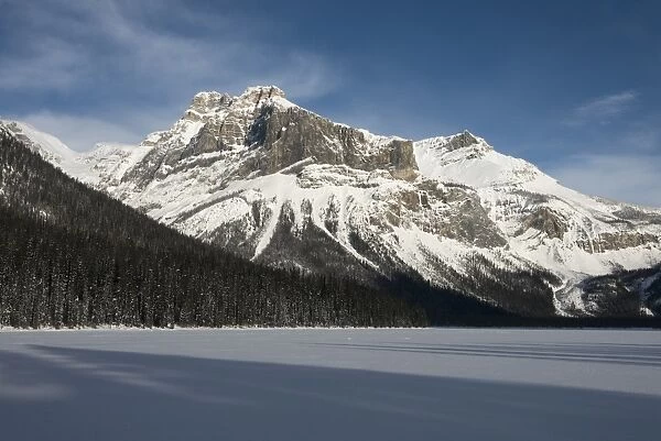 Snow on the rugged Canadian Rocky Mountains and a snow covered field, Yoho National Park