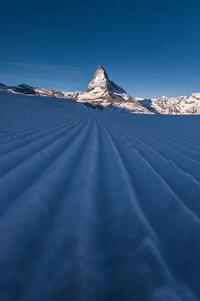 Snow ski track pattern with Matterhorn background