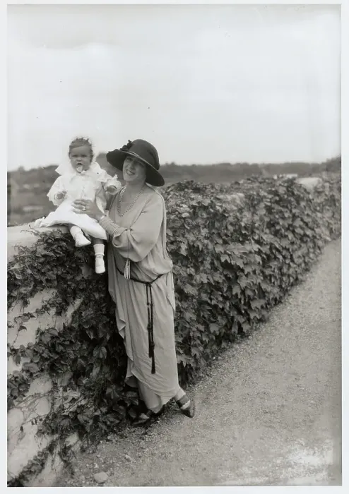 Framed Print : Socialite Woman Holding infant Framed Print : Socialite Woman Holding infant