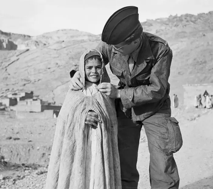 Framed Print : Soldier Adjusting Cape for Youngster Framed Print : Soldier Adjusting Cape for Youngster