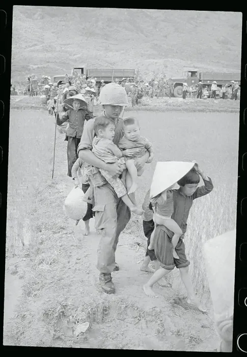 Framed Print : Soldier Aiding Children