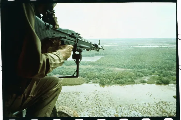 Framed Print : Soldier Aiming Machine Gun from Helicopter Framed Print : Soldier Aiming Machine Gun from Helicopter
