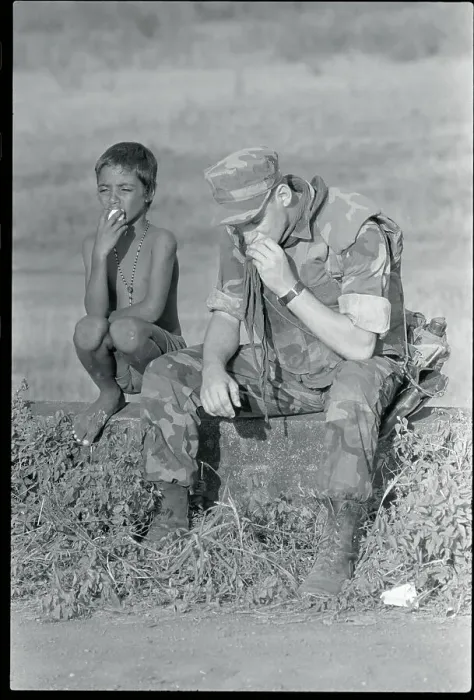 Framed Print : Soldier and Boy Sharing Orange Framed Print : Soldier and Boy Sharing Orange