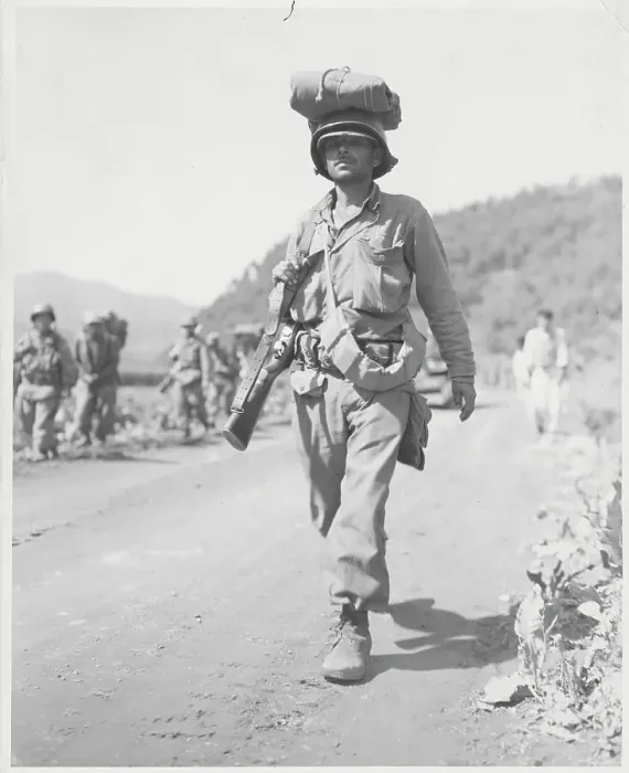 Framed Print : Soldier Carrying Equipment atop Head Framed Print : Soldier Carrying Equipment atop Head