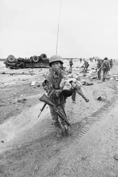Framed Print : Soldier Carrying Wounded Youngster Framed Print : Soldier Carrying Wounded Youngster