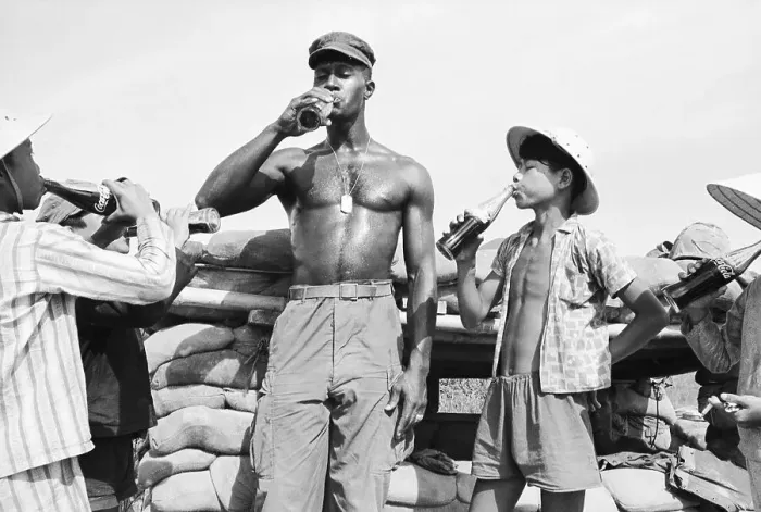 Framed Print : Soldier Drinks Coke With Kids In Nam