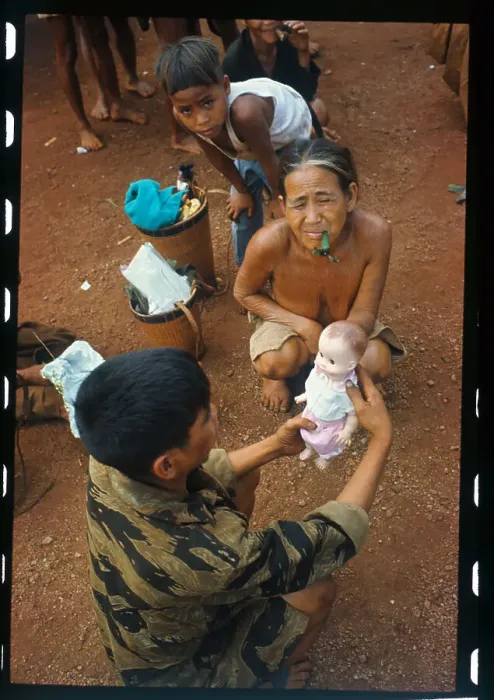 Framed Print : Soldier Giving a Doll to a Youngster Framed Print : Soldier Giving a Doll to a Youngster