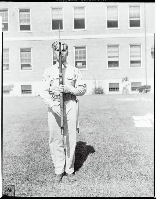 Framed Print : Soldier Holding Weapon in Front of his Body