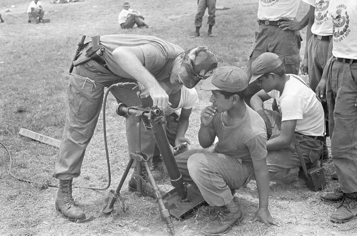 Framed Print : Soldier Instructs Cadet on Mortar Operation Framed Print : Soldier Instructs Cadet on Mortar Operation