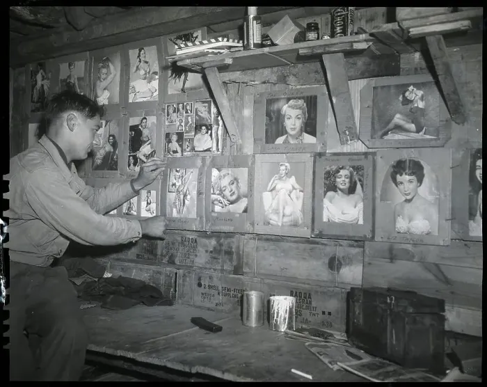 Framed Print : Soldier Putting Picture On Pinup Wall Framed Print : Soldier Putting Picture On Pinup Wall