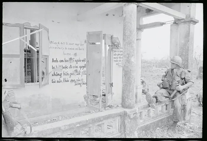Framed Print : US Soldier Reads a Sign in Hue, S.Vietnam Framed Print : US Soldier Reads a Sign in Hue, S.Vietnam