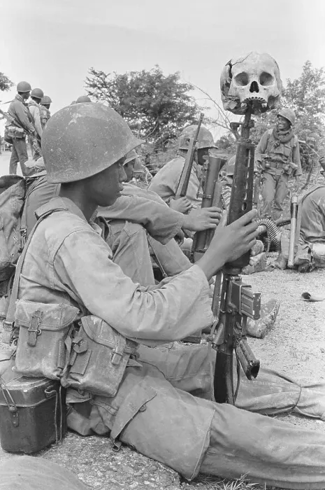 Framed Print : Soldier Resting with Skull on Rifle Framed Print : Soldier Resting with Skull on Rifle