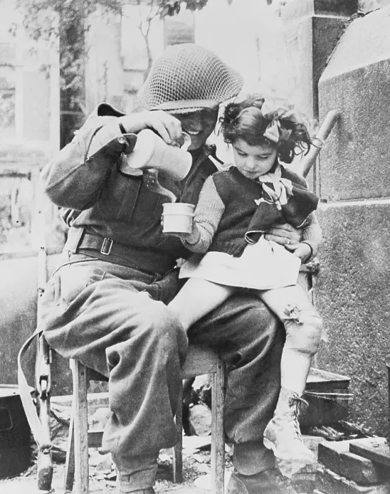 Framed Print : Soldier Sharing Soup with Young Girl
