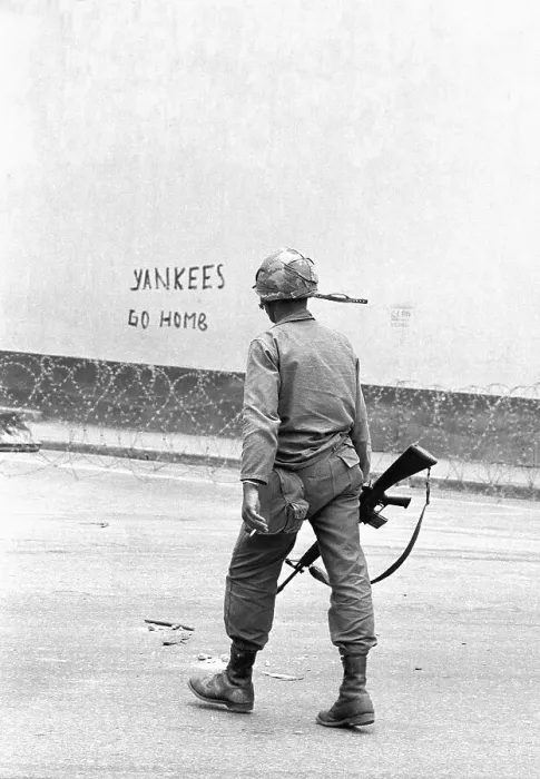 Framed Print : Soldier Walks Past Graffiti Framed Print : Soldier Walks Past Graffiti