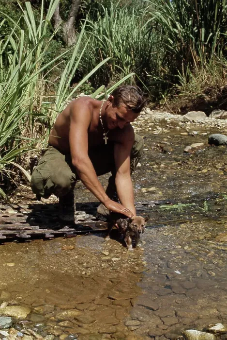 Framed Print : Soldier Washing Dog