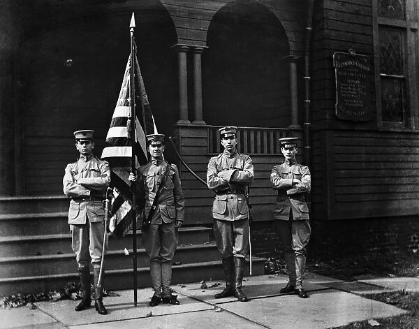 Four soldiers. UNITED STATES - CIRCA 1900s: Group of four soldiers in uniform standing