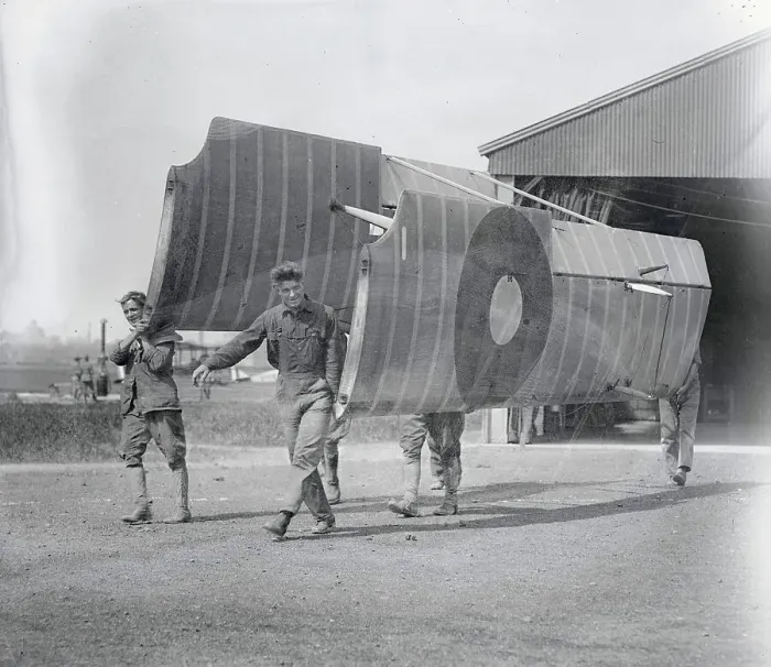 Framed Print : Soldiers Carry Aircraft Wings Framed Print : Soldiers Carry Aircraft Wings