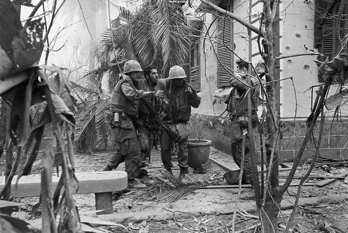 Framed Print : Soldiers Helping Injured Friend to Safety Framed Print : Soldiers Helping Injured Friend to Safety
