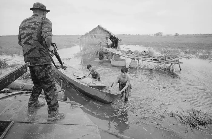 Framed Print : Soldiers Inspecting Huts In Delta Framed Print : Soldiers Inspecting Huts In Delta