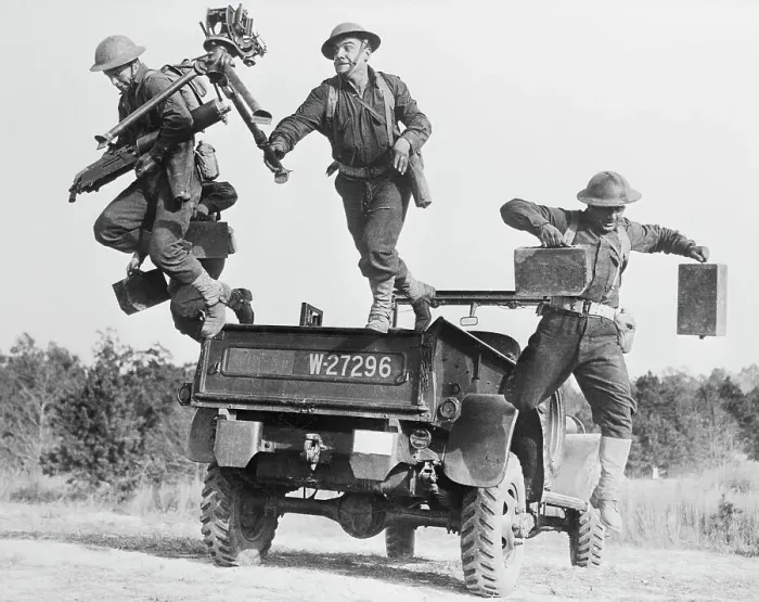 Framed Print : Soldiers Jumping off Back of Vehicle Framed Print : Soldiers Jumping off Back of Vehicle