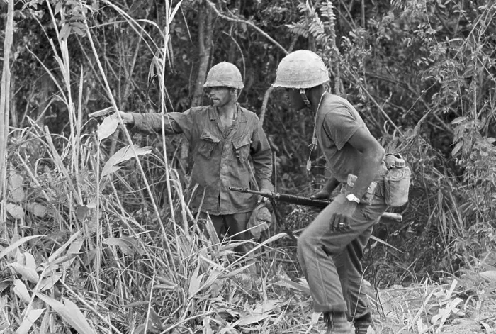 Framed Print : Soldiers Look in Brush For Sniper Framed Print : Soldiers Look in Brush For Sniper