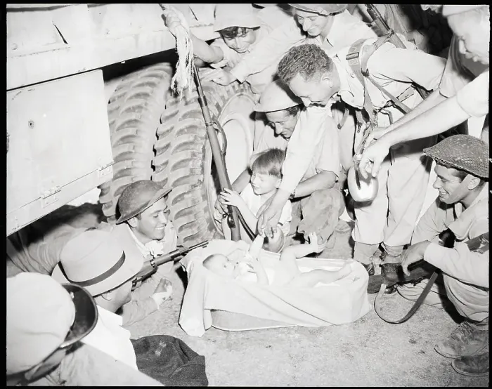 Framed Print : Soldiers Playing With Small Baby Framed Print : Soldiers Playing With Small Baby