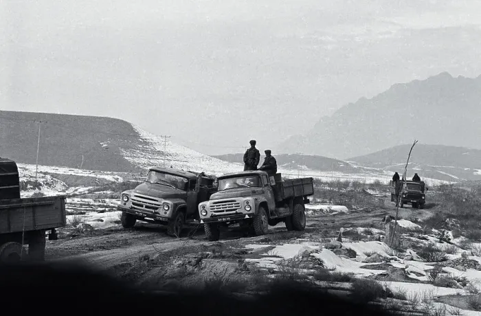 Framed Print : Soldiers Stand on One of Two Trucks Framed Print : Soldiers Stand on One of Two Trucks