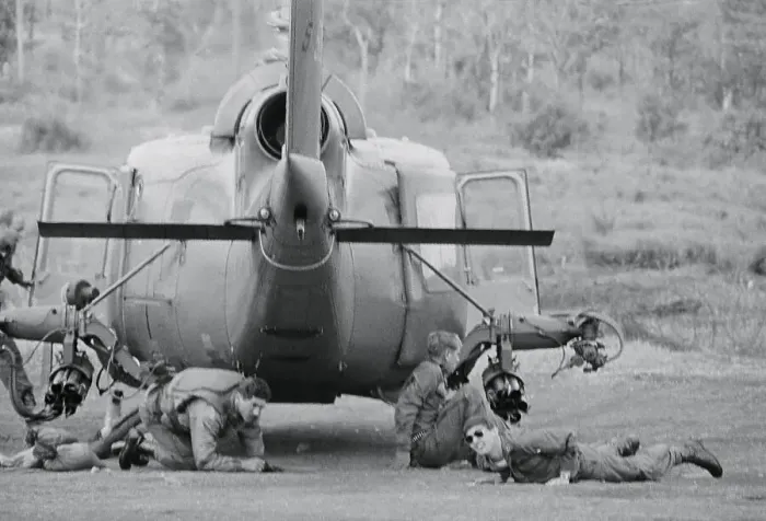 Framed Print : Soldiers Taking Refuge Under Helicopter Framed Print : Soldiers Taking Refuge Under Helicopter