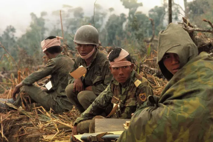 Framed Print : Soldiers Waiting on Ground for Help Framed Print : Soldiers Waiting on Ground for Help