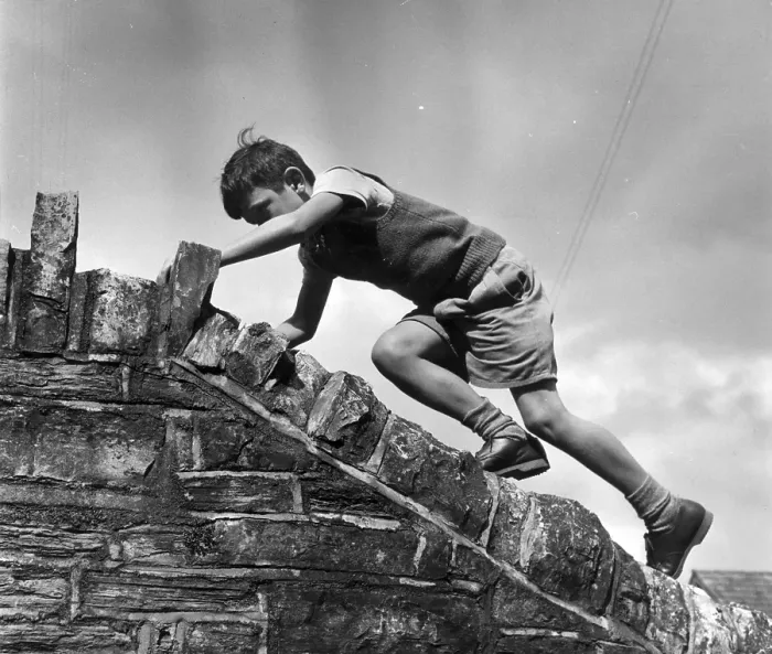 Framed Print : Sole Heir. July 1955: One of the children of Street in Somerset puts a Framed Print : Sole Heir. July 1955: One of the children of Street in Somerset puts a