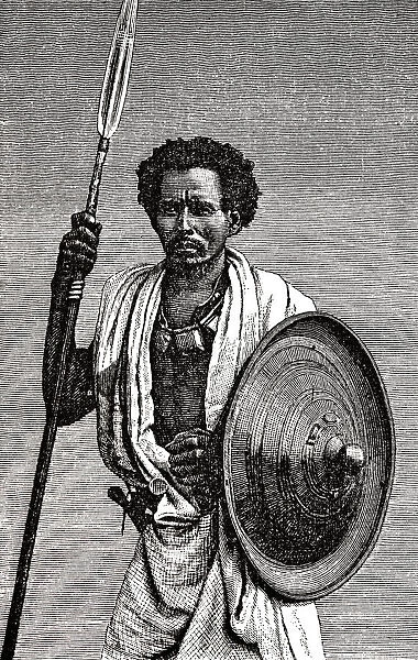 Somali man of Danakil, standing, holding spear and shield