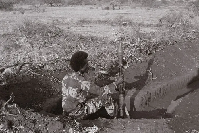 Framed Print : Somali Soldier Sitting with Weapon Framed Print : Somali Soldier Sitting with Weapon