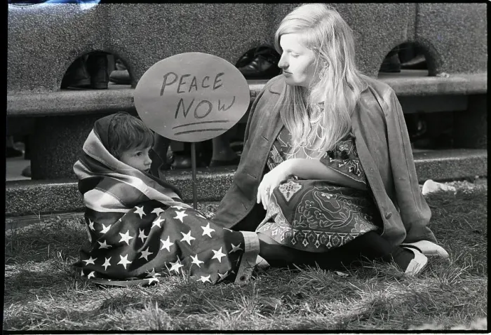 Framed Print : Son in US Flag Sits with Mother on Ground