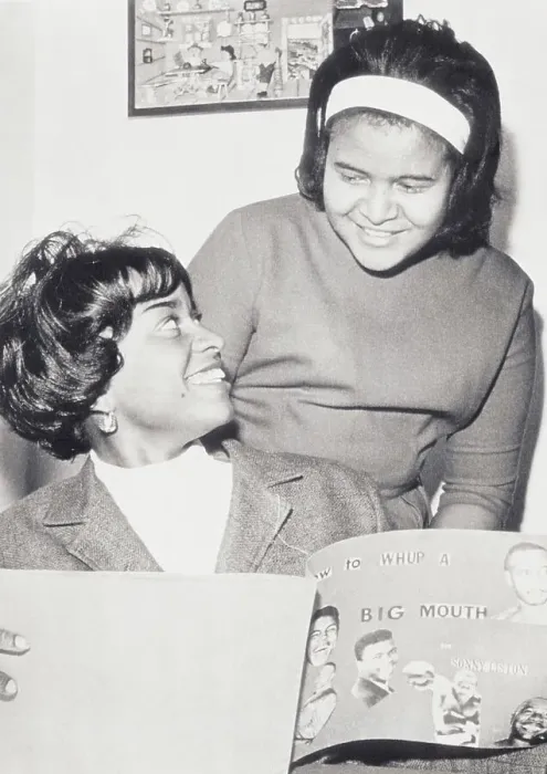 Framed Print : Sonny Liston's Daughters Happily Sharing Their Father's Scrapbook