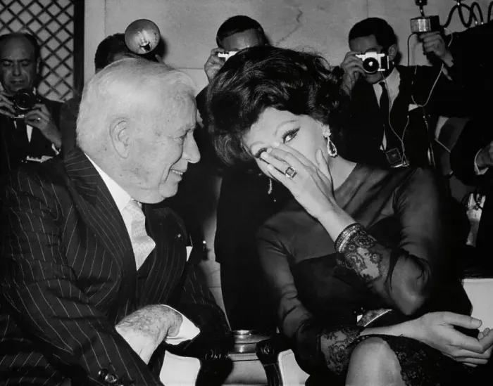 Framed Print : Sophia Loren Whispering to Charlie Chaplin Framed Print : Sophia Loren Whispering to Charlie Chaplin