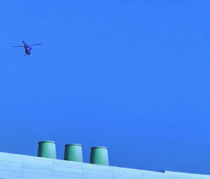 Framed Print : Sortie. A color photo of a helicopter flying over a commercial building Framed Print : Sortie. A color photo of a helicopter flying over a commercial building