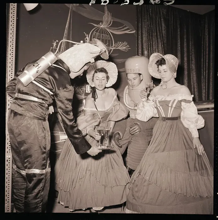 Framed Print : Space-Age Waiters Serve Victorian Women Framed Print : Space-Age Waiters Serve Victorian Women