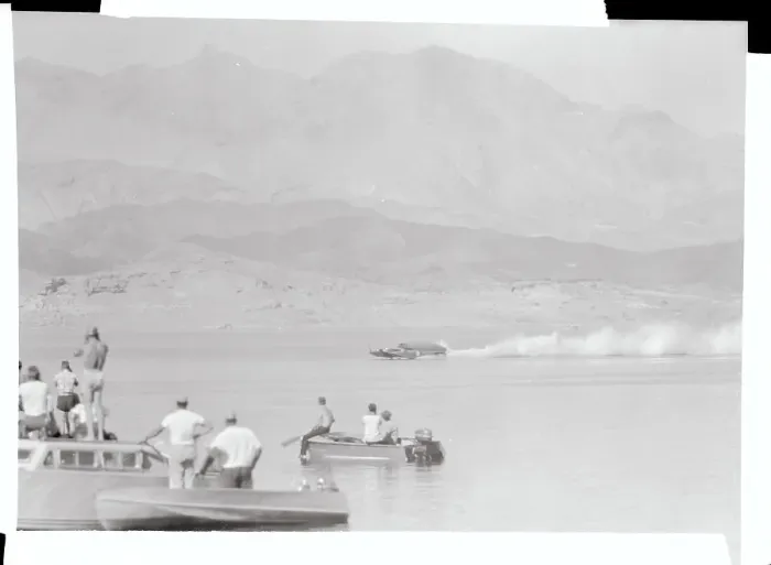 Framed Print : Spectators Watching a Passing Speedboat Framed Print : Spectators Watching a Passing Speedboat
