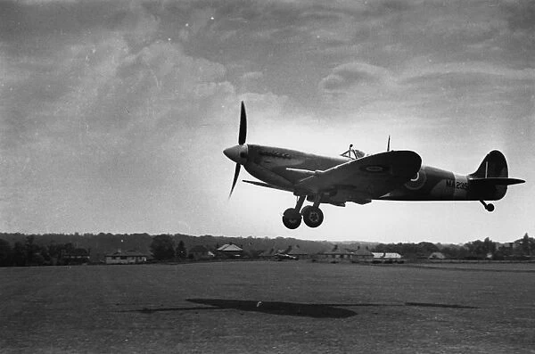 Spitfire. circa 1939: A Supermarine Spitfire landing at an airfield 