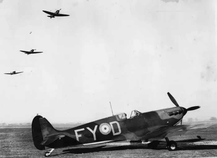 Framed Print : Spitfires. 11th January 1940: A Royal Air Force Spitfire on the ground and three in flight Framed Print : Spitfires. 11th January 1940: A Royal Air Force Spitfire on the ground and three in flight